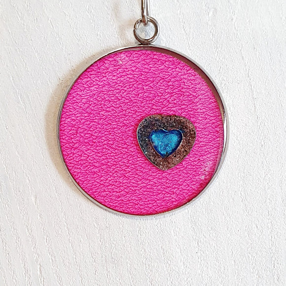 Colourful pendants with a heart and added sand from Cornwall.