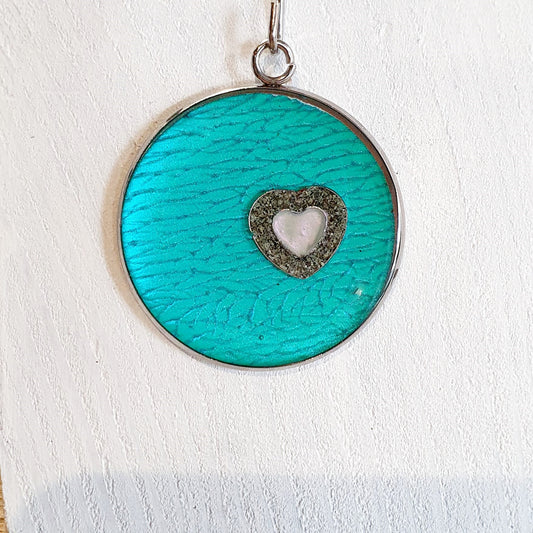 Colourful pendants with a heart and added sand from Cornwall.
