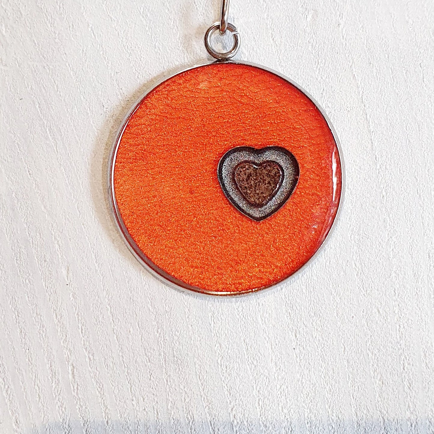 Colourful pendants with a heart and added sand from Cornwall.